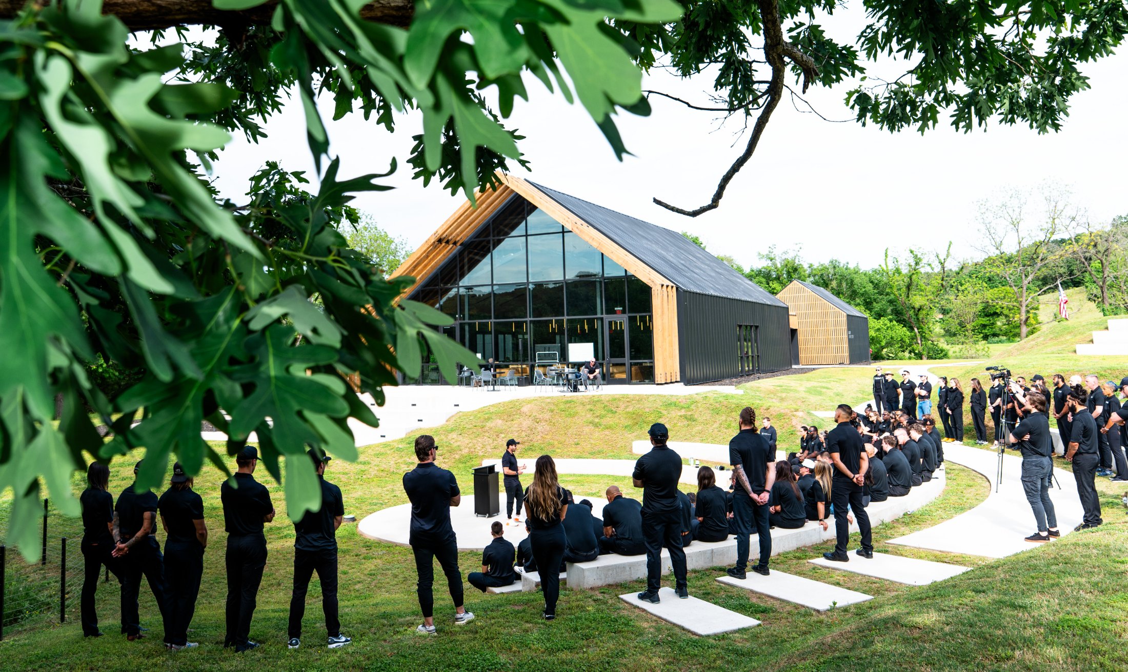 UHP staff and students gathered at the campus amphitheater