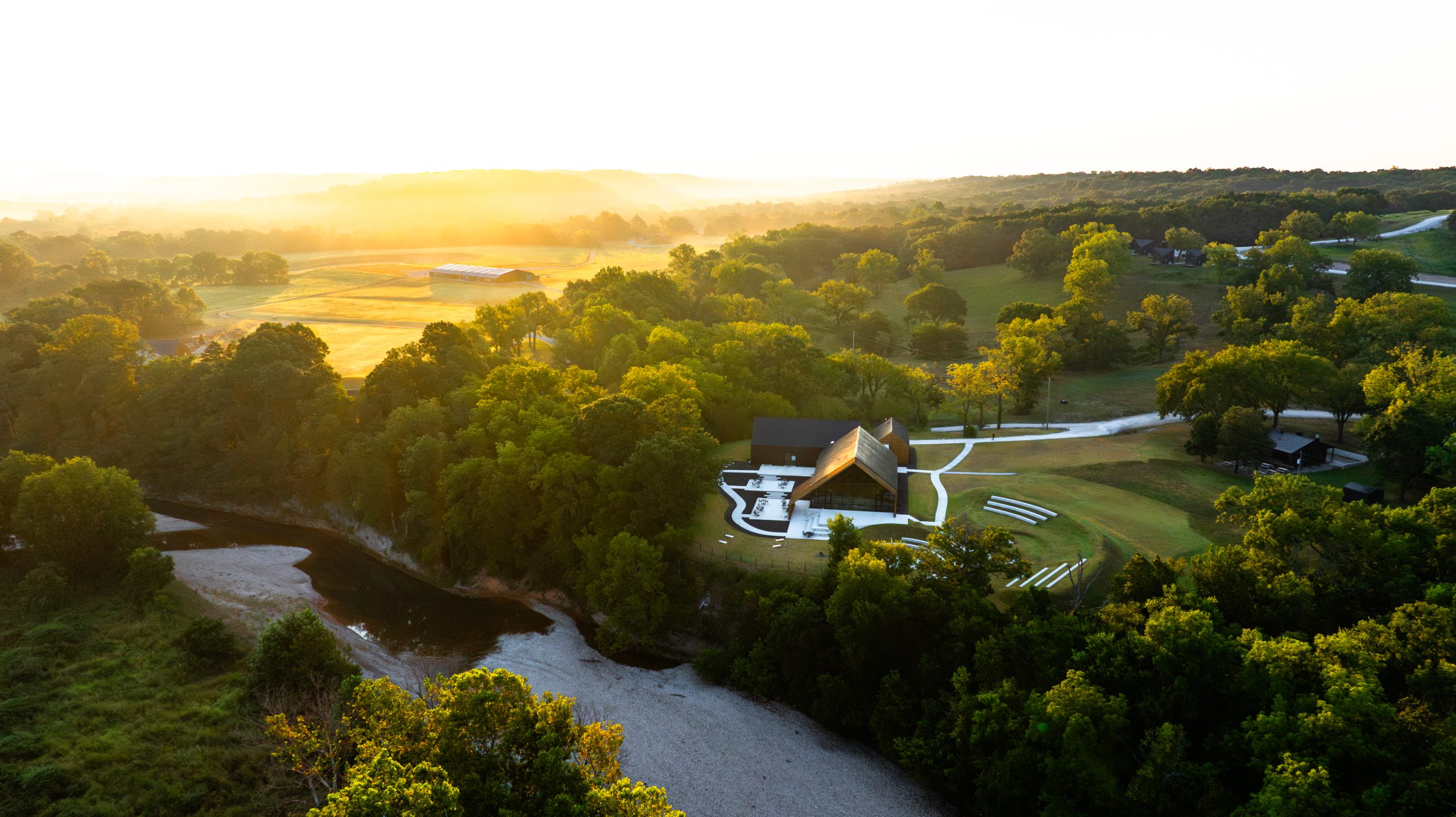 Aerial of UHP's campus in Northwest Arkansas at golden hour