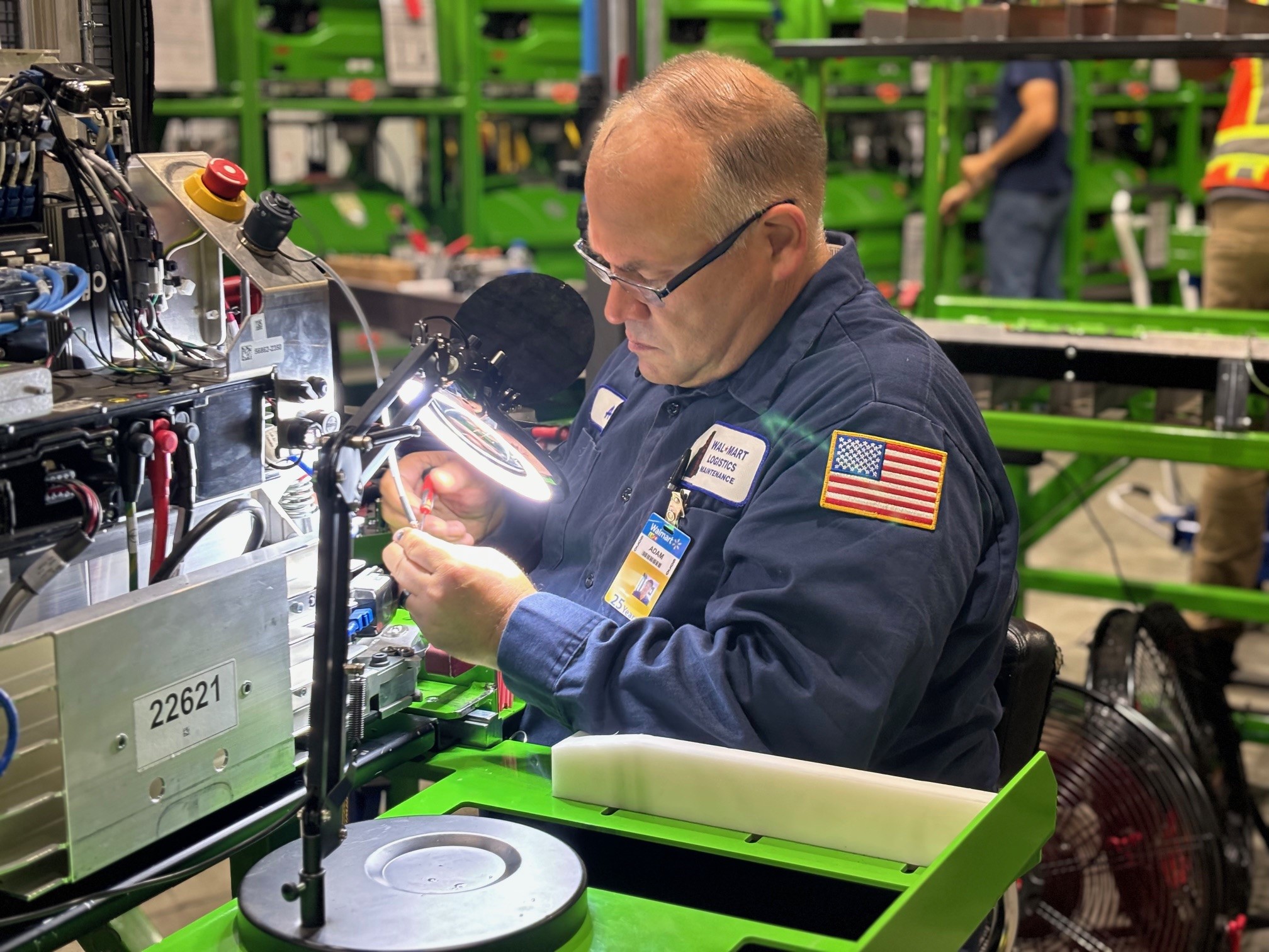 A Walmart Logistics maintenance technician at work